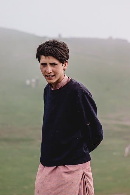 professional portrait of young Japanese male data analyst in casual office